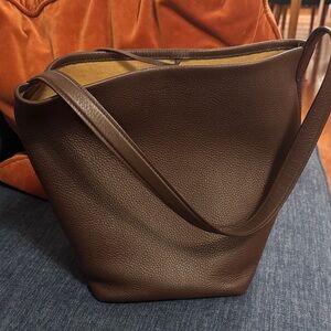 The Row Medium North South Park Tote in dark brown (acajou)